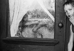 Children in window, Detroit 1966