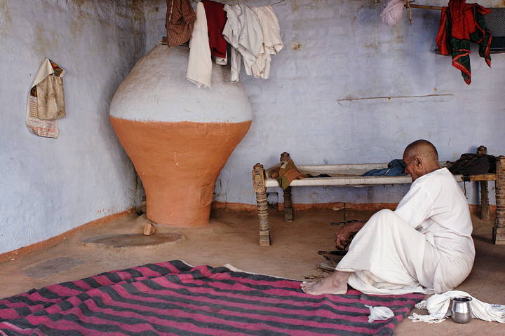 Bishnoi farmer preparing beverage